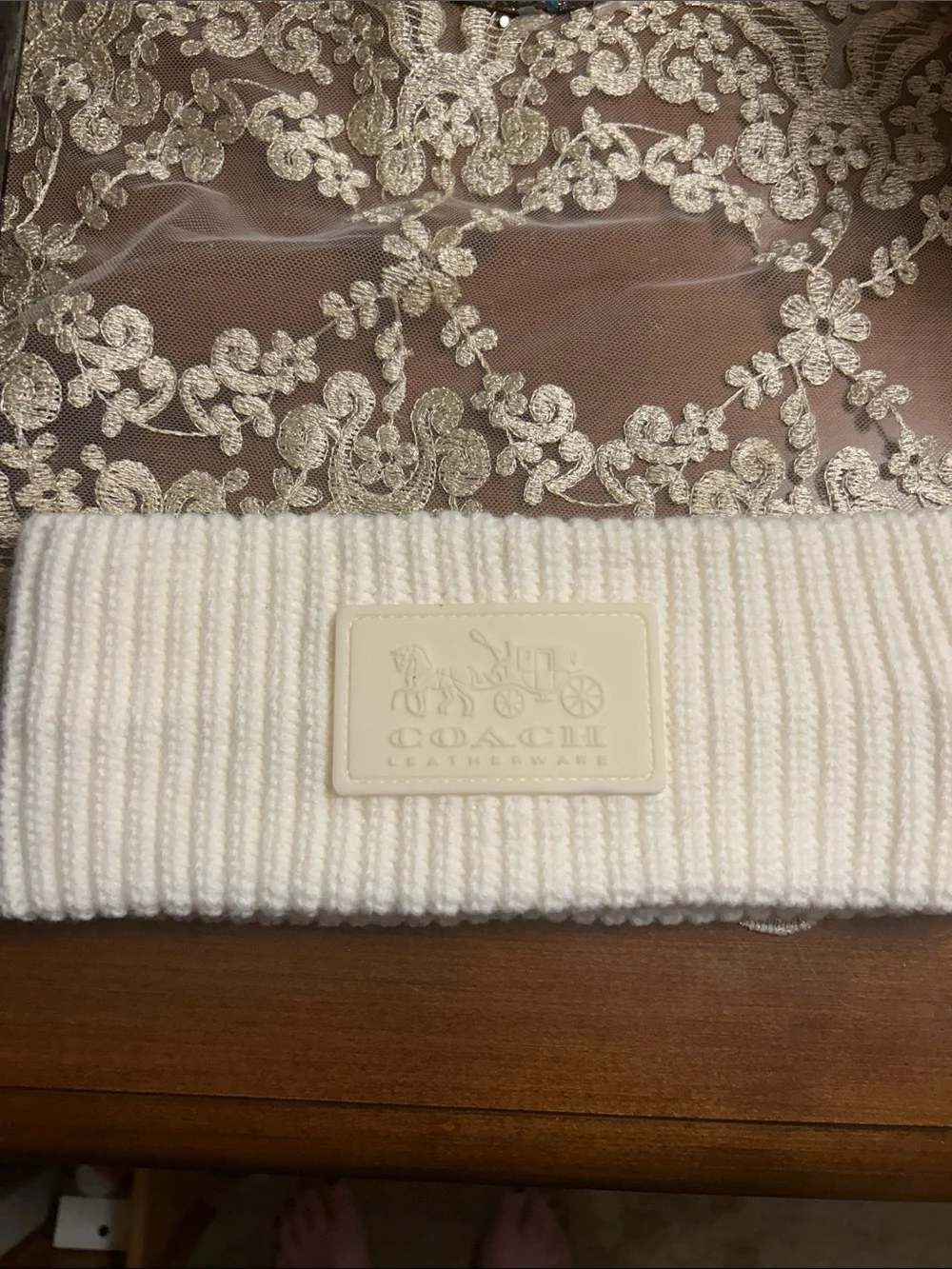 Coach Cream Ribbed Knit Beanie with Embossed Leatherware Patch. Like new.